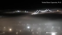 Breathtaking timelapse shows fog rolling over city