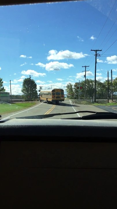 School Bus Crosses Closed Train Tracks