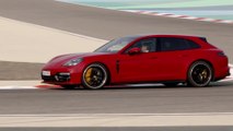Porsche Panamera GTS Sport Turismo Driving on the track in Carmine Red