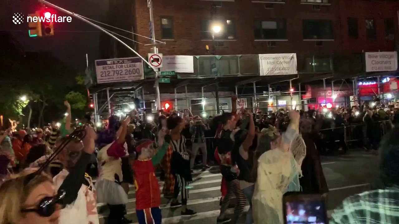 Costumed dancers move to the tune of 'Thriller' at NYC Village Halloween Parade