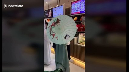 Half-snake, half-human Halloween costume scares shoppers at Beijing mall