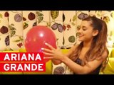 Ariana Grande pops balloons to answer YOUR questions