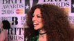 Jess Glynne on the Brits 2016 red carpet with James Barr