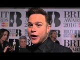 Olly Murs hits the Brits 2016 red carpet with James Barr