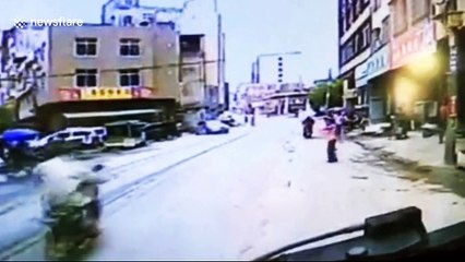 Scooter driver narrowly escapes being run over by lorry