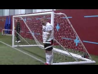 James Milner kicks footballs at FHM