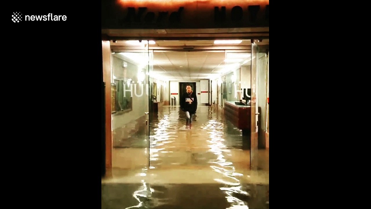Model does catwalk through flooded Venice hotel lobby