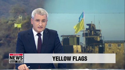 Koreas hoist yellow flags at DMZ guard posts to show they are being dismantled