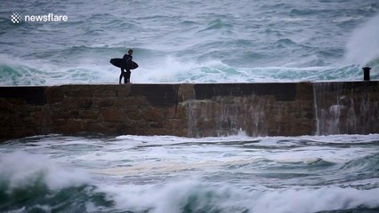 Surfer swept off his feet at Cornwall beach by strong post-Hurricane Oscar waves