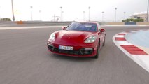 Porsche Panamera GTS in Carmine Red Driving on the track