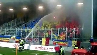 Fire Brigade Using Water On Soccer Fan