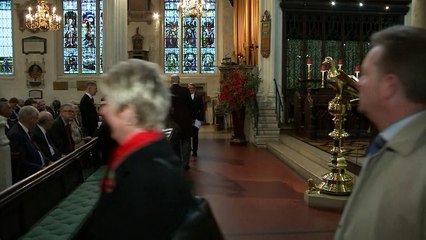 May and Corbyn attend rememberance service