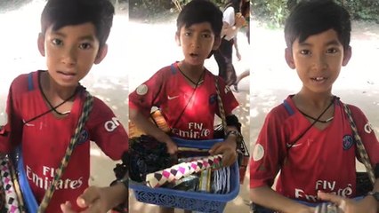 Young souvenir seller shows off linguistic skills