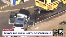 Two people injured after a car collided with a school bus near north Scottsdale