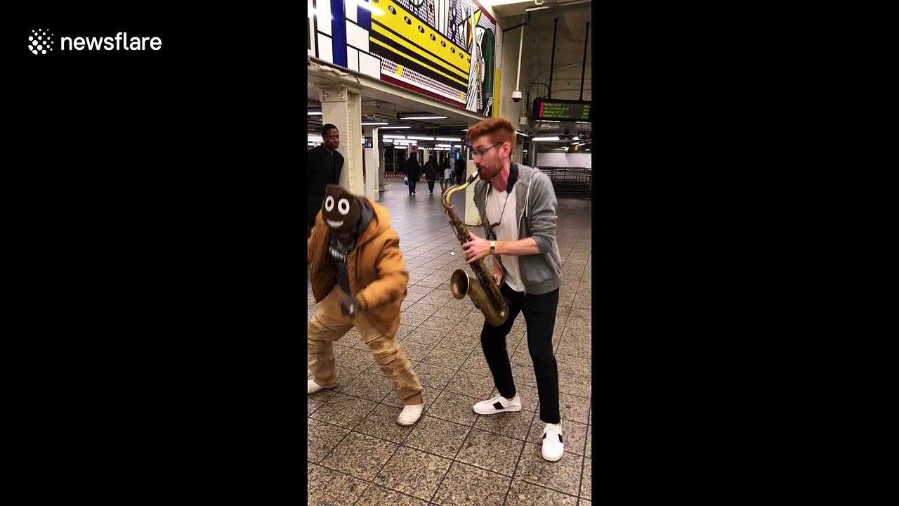 Sax player in NYC subway plays Bruno Mars tune as homeless man dances