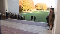 Theresa May lays a wreath at a war memorial in France