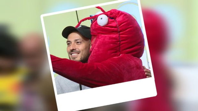 David Silva takes selfies with a lobster and dolphin at prize giveaway