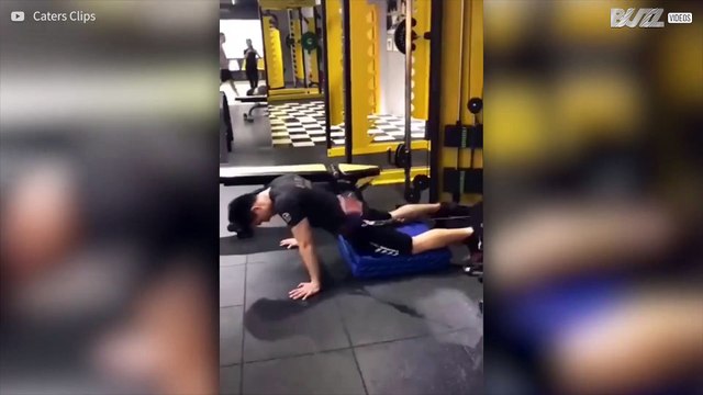 Man does bizarre hip thrust exercise in the gym