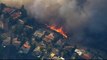 Raging California wildfires kill 9, force thousands to flee