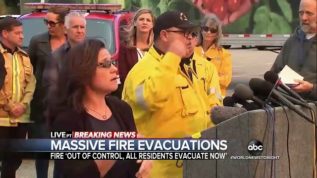 Fast-moving fires force mass evacuations in southern California