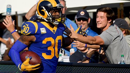 Gurley high-fives fans along end zone after TD