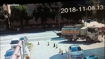 Scooter driver narrowly escapes being run over by truck