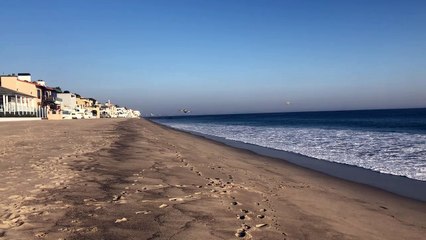 Aircraft Retrieves Ocean Water for Fire Fighting Efforts