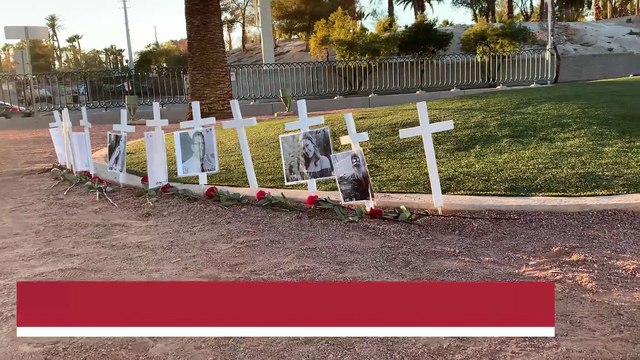 Memorial crosses left at Welcome to Las Vegas sign for victims of Thousand Oaks shooting