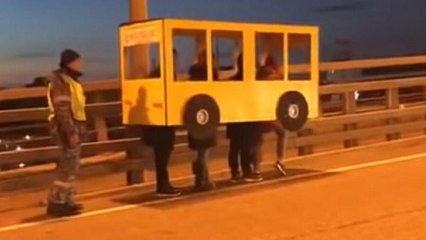 Watch: Russians dress up as a bus to cross vehicle-only bridge