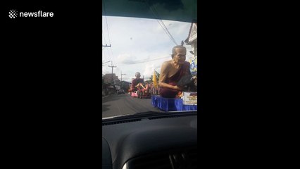 Thailand prepares for festival with a parade of giant monk statues