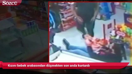 Kızını bebek arabasından düşmekten son anda kurtardı