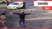 Police confront man waving ‘samurai sword’ on a street in broad daylight | SWNS TV