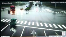 Oblivious scooter rider escapes being crushed by out-of-control lorry