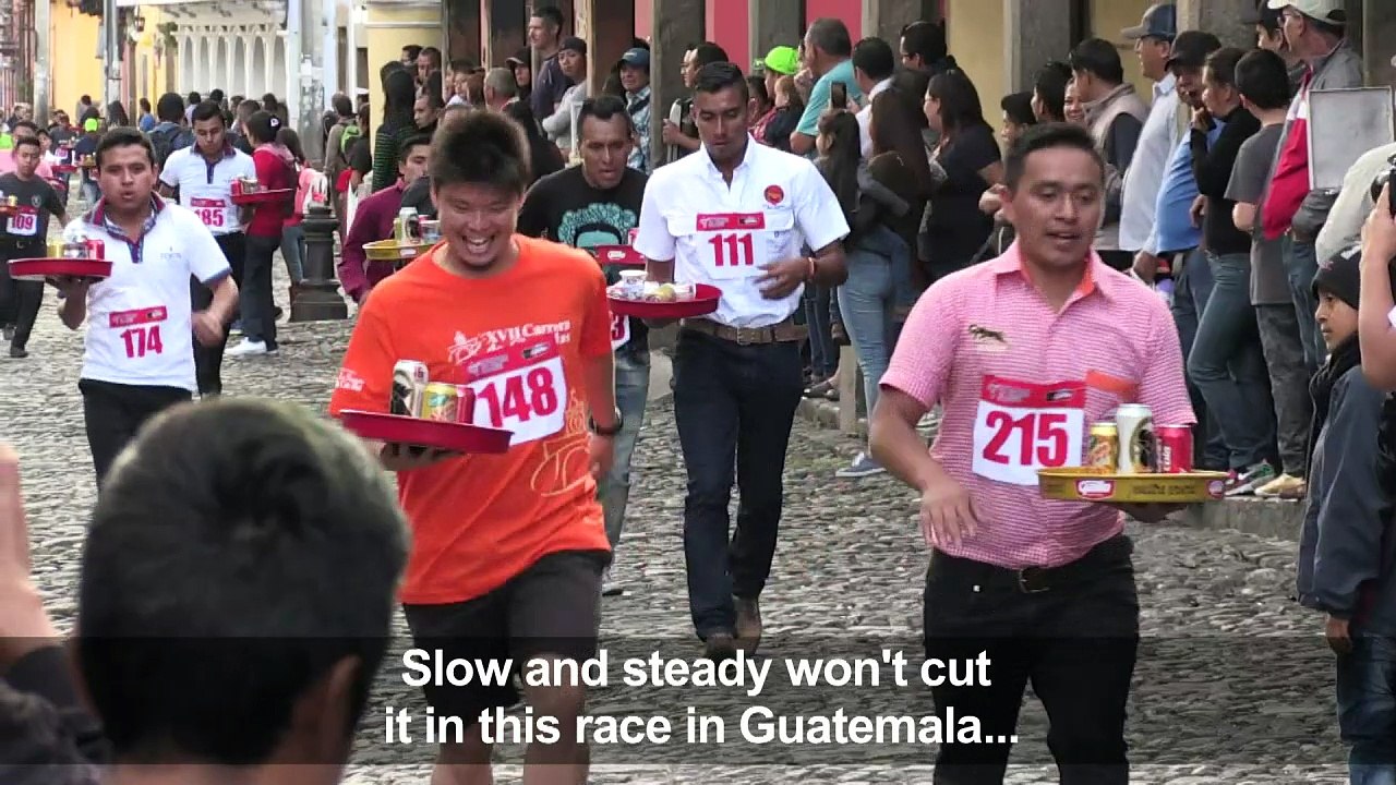 Waiters race down cobbled streets in Guatemala'...