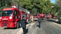 Antalya'da 600 metrelik sarp arazide çıkan yangında hortum taşıma seferberliği
