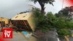 Freak storm overturns container housing, falls trees in Penang