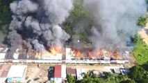 Firemen and villagers battling fire at Niah longhouse