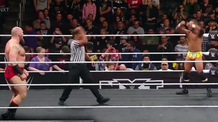 Keith Lee pounces Lars Sullivan out of the ring