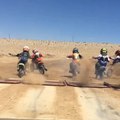 Kid Accidentally Causes Opponent to Crash in Dirt Bike Race