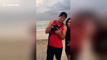 Boyfriend makes surprise beachside proposal under a rainbow