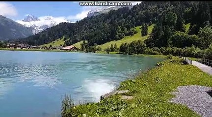 overlooking the mountains and the lake of switzerland