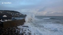 Huge Storm Diana waves surge over Mousehole Harbour wall in Cornwall