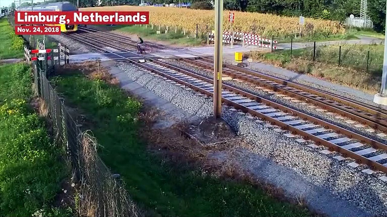 Cyclist Has Close Call With Speeding Train