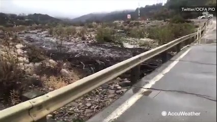 Rain and debris rush down hill off burn scar areas