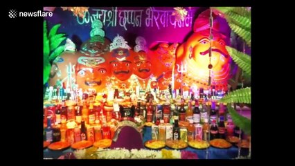 Worshippers receive cigarettes, alcohol and sweets at bizarre Hindu shrine