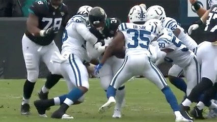 Denico Autry punches out ball to cause Carlos Hyde fumble