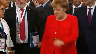 Angela Merkel caught reading ‘CHEAT SHEET’ before Australian PM meeting