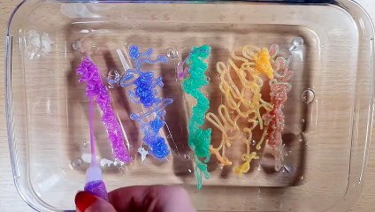 Mixing Glitter Glue into Clear Slime