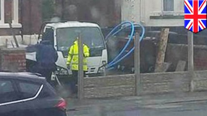 Workers trap their own van by building a fence around it