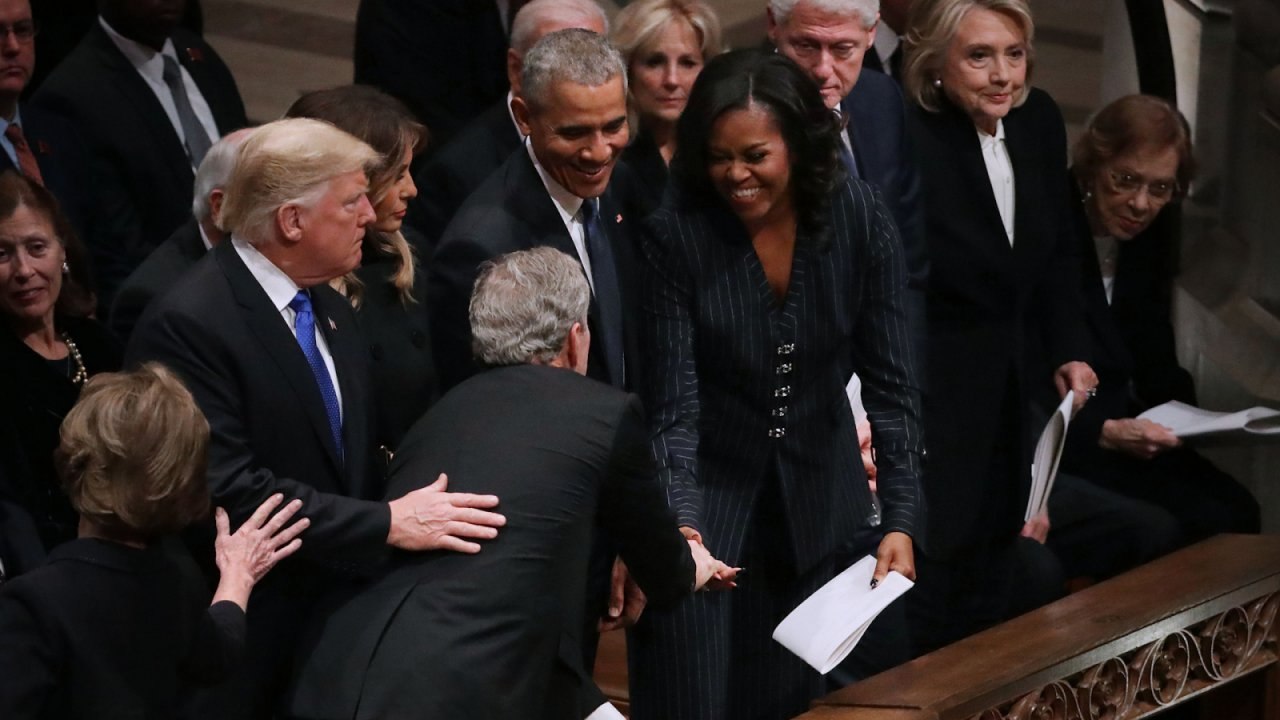 George W. Bush Slips Candy To Michelle Obama At Father's Funeral